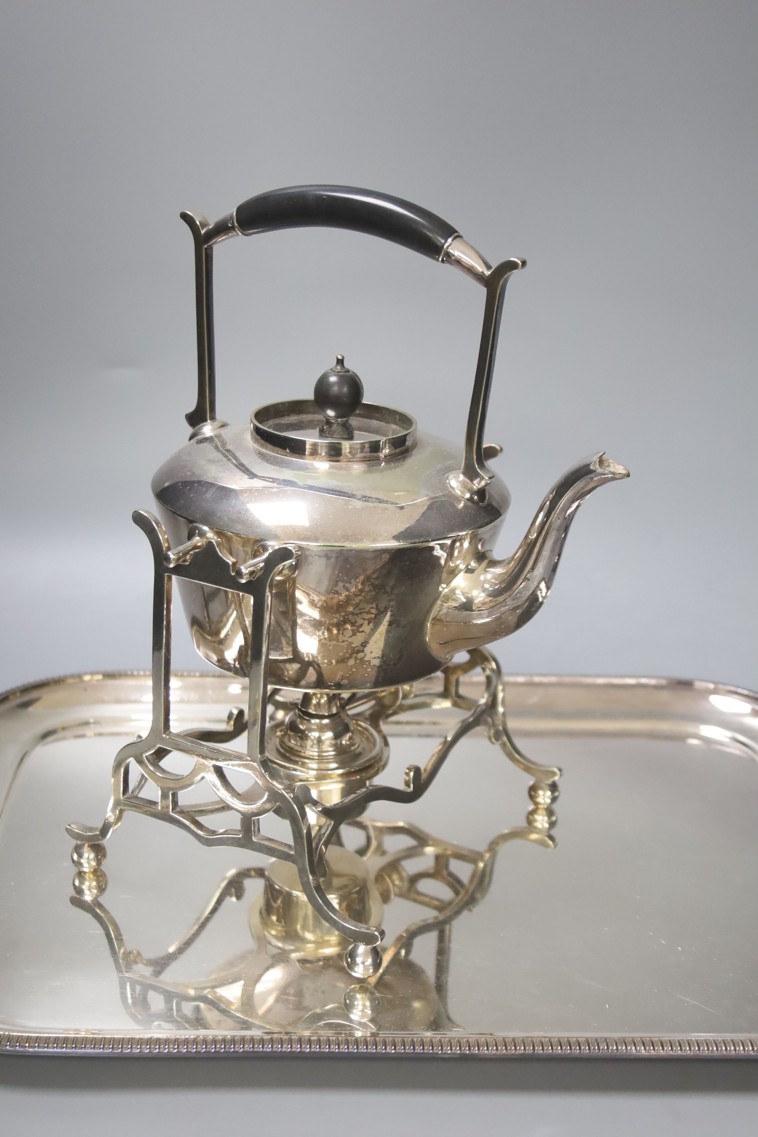 Sundry plated wares including a spirit kettle, stand and burner, and a two handled tea tray